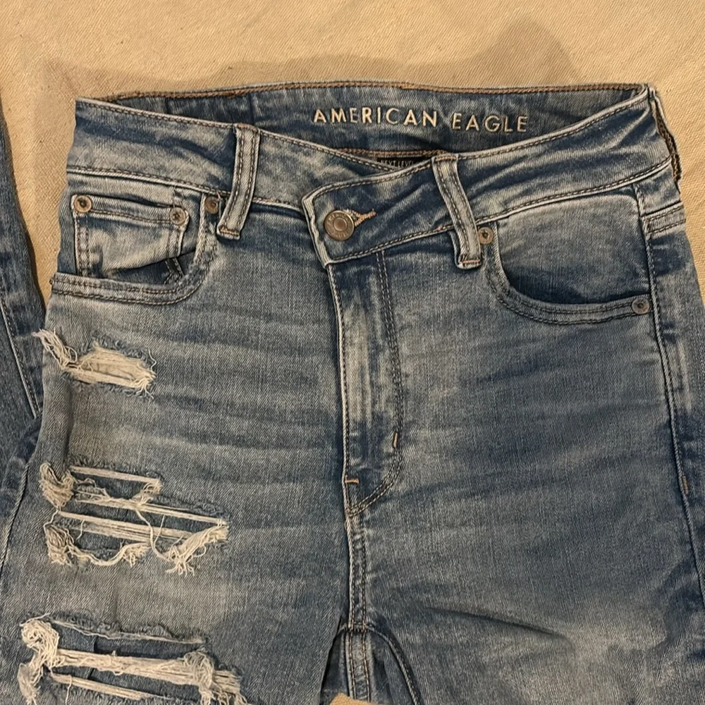 American Eagle Outfitters Women's Distressed Blue Flare Jeans - Picture 4 of 4